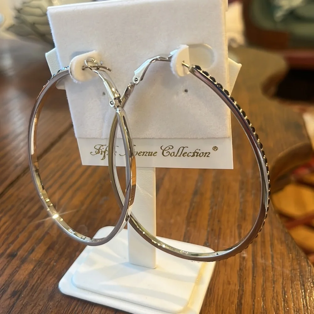Large rhodium hoops with striking black Swarovski crystals. - Picture 2 of 7